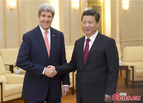 Chinese President Xi Jinping (R) meets with US Secretary of State John Kerry at the Great Hall of the People in Beijing on Feb 14, 2014. (Photo: China News Service / Sheng Jiapeng)