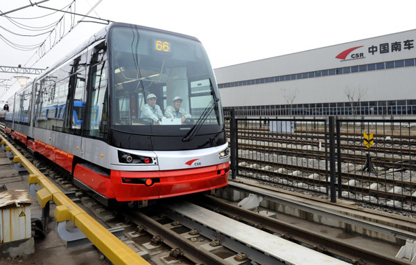 Workers test an advanced prototype tram on Monday in Qingdao, East China's Shandong province. [Photo/Xinhua]