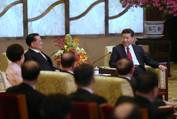 Xi Jinping (R), general secretary of the Communist Party of China Central Committee, meets with visiting Kuomintang Honorary Chairman Lien Chan in Beijing, Feb 18, 2014. [Xu Jingxing/China Daily]
