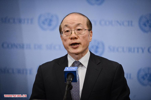 Chinese Permanent Representative to the United Nations Liu Jieyi speaks to media reporters after the UN Security Council adopted a resolution on Syria, at the UN headquarters in New York, on Feb. 22, 2014. China on Saturday called for the comprehensive implementation of a resolution adopted earlier by the UN Security Council to boost humanitarian aid access in Syria. (Xinhua/Niu Xiaolei)