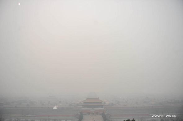 The Imperial Palace is blanketed by fog and smog in Beijing, capital of China, Feb. 24, 2014. Many parts of China were hit by heavy smog on Monday. And the serious pollution will remain intact in Beijing over the next three days. (Xinhua/Li Wen)