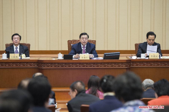 Zhang Dejiang (C), chairman of the Standing Committee of the National People's Congress (NPC), presides over the opening meeting of the seventh session of the 12th NPC Standing Committee, in Beijing, capital of China, Feb 25, 2014.  (Xinhua/Wang Ye)