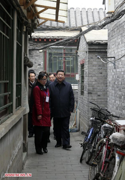 Chinese President Xi Jinping (R), also general secretary of the Communist Party of China (CPC) Central Committee and chairman of the Central Military Commission, visits the Yu'er Hutong, an alleyway in Dongcheng District, during an inspection tour in Beijing, capital of China. (Xinhua/Ding Lin) 