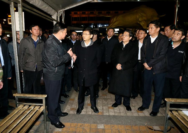Meng Jianzhu (2nd L F), head of the Central Commission for Political and Legal Affairs of the Communist Party of China, inspects the crime scene at the Kunming Railway Station in Kunming, capital of southwest China's Yunnan Province, March 2, 2014. At least 29 innocent people were killed and more than 130 others injured during a terrorist attack at the railway station Saturday night. (Xinhua/Hao Fan)