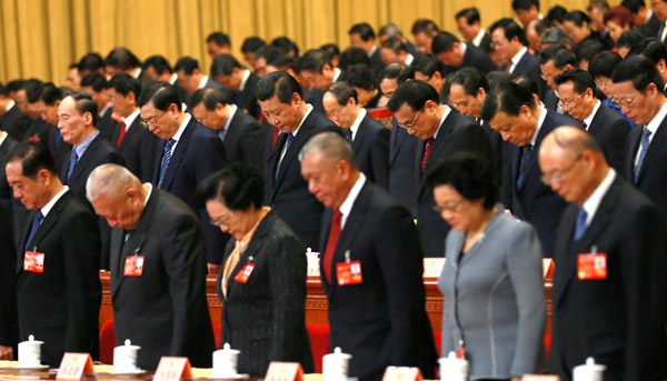 Top leaders including President Xi Jinping and Premier Li Keqiang join members of the National Committee of the Chinese People's Political Consultative Conference to mourn those who died in Saturday's terrorist attack in Kunming, capital of Yunnan province, as the annual session of the country's top political advisory body opens in Beijing on Monday. ZOU HONG / CHINA DAILY 
