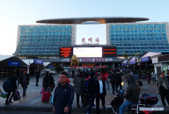 Passengers walk on the square of the Kunming Railway Station in Kunming, capital of southwest China's Yunnan province, March 2, 2014. The order at the railway station has been restored to normal after an overnight terrorist attack which left 29 people dead and 130 others injured. (Xinhua/Zhu Guigen)