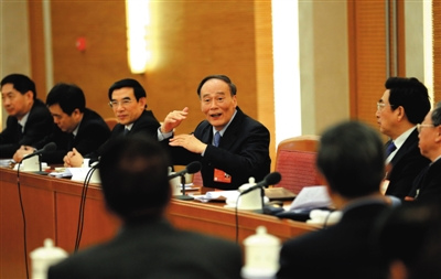 Secretary of the Central Commission for Discipline Inspection Wang Qishan attends a panel discussion on March 5, 2014. (Xinhua) 
