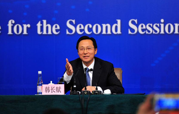 Agriculture Minister Han Changfu speaks at a press conference during the second session of the National People's Congress in Beijing, March 6, 2014. [Photo/Xinhua]