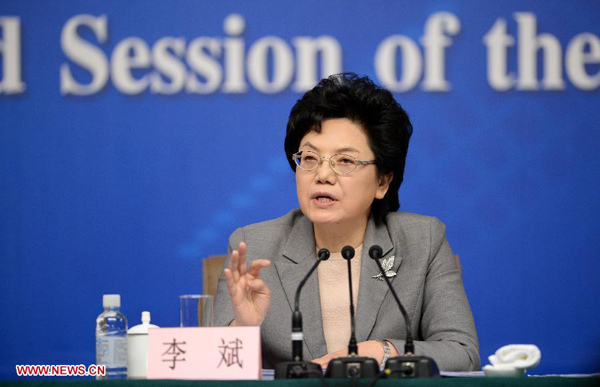 Head of China's National Health and Family Planning Commission Li Bin gives a press conference for the second session of China's 12th National People's Congress (NPC) on health and family planning reform, in Beijing, capital of China, March 6, 2014. (Xinhua/Wang Peng) 