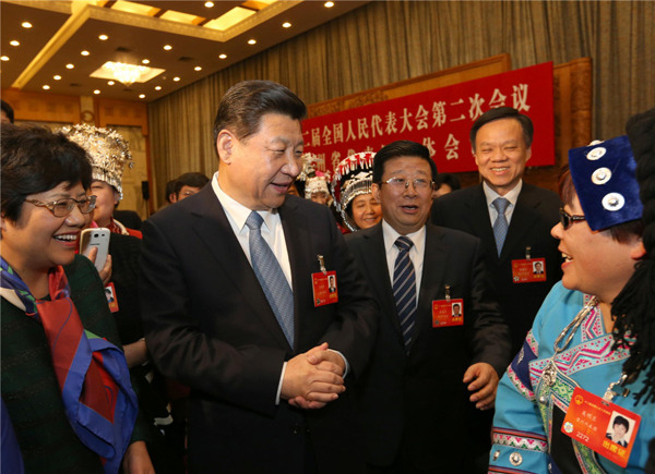 hinese President Xi Jinping (2nd R), also general secretary of the Communist Party of China (CPC) Central Committee and chairman of the Central Military Commission, talks with female deputies to the 12th National People's Congress (NPC) in Beijing, capital of China, March 7, 2014. [Photo/Xinhua]