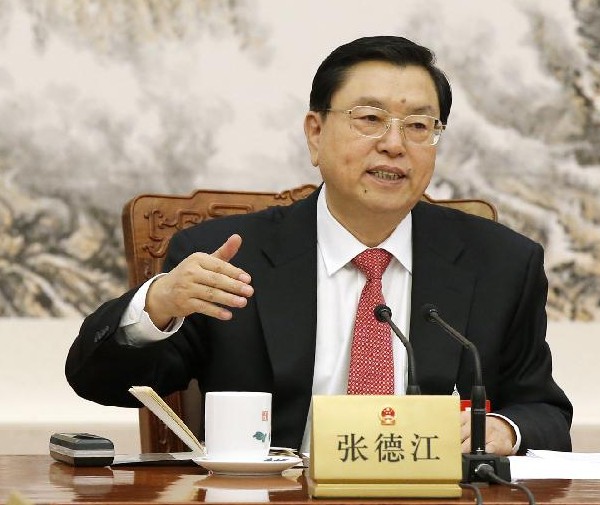 Zhang Dejiang, executive chairperson of the presidium of the second session of China's 12th National People's Congress (NPC) and chairman of the NPC Standing Committee, presides over the first meeting of the presidium's executive chairpersons at the Great Hall of the People in Beijing, capital of China, March 8, 2014. (Xinhua/Ju Peng)
