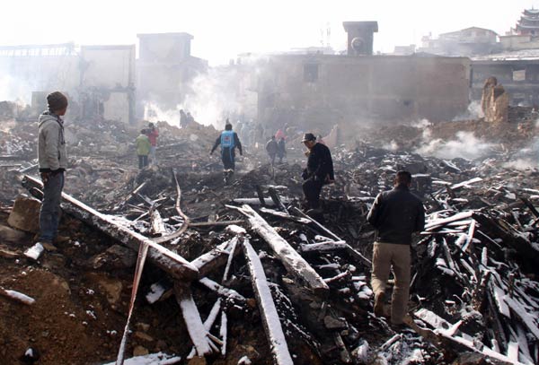The Dukezong Ancient Town, known for well-preserved Tibetan homes in Shangri-la county of Yunnan province, lost nearly 300 houses, or two-thirds of the entire town, after a fire broke out on Jan 11. Li Shanming / for China Daily
