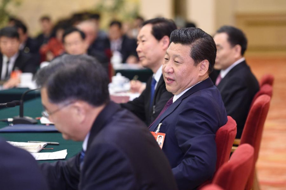 President Xi Jinping, also general secretary of the Communist Party of China (CPC) Central Committee and chairman of the Central Military Commission, joins a discussion with deputies to China's 12th National People's Congress (NPC) from east China's Anhui Province during the second session of the 12th NPC, in Beijing, capital of China, March 9, 2014. (Xinhua/Li Xueren)