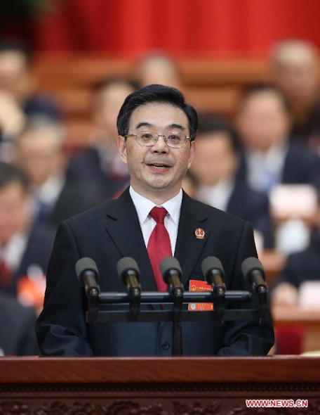 Zhou Qiang, president of China's Supreme People's Court (SPC), delivers a report on the SPC's work at the third plenary meeting of the second session of China's 12th National People's Congress (NPC) at the Great Hall of the People in Beijing, capital of China, March 10, 2014. (Xinhua/Yao Dawei)