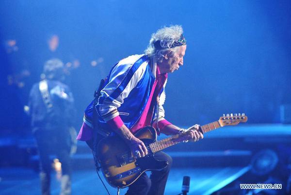 Keith Richards of The Rolling Stones performs during their concert at Mercedez-Benz Arena in Shanghai, China, March 12, 2014. (Xinhua/Xiao Xiao)