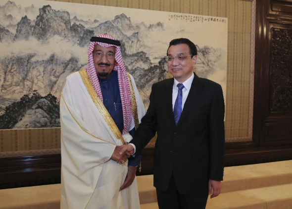 Chinese Premier Li Keqiang (R) shakes hands with visiting Saudi Arabian Crown Prince Salman Bin Abdulaziz Al Saud, also deputy prime minister and defense minister of Saudi Arabia, in Beijing, capital of China, March 14, 2014. (Xinhua/Ding Lin)