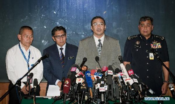 Malaysia Airlines Group CEO Ahmad Jauhari Yaya, Director General of the Malaysian Department of Civil Aviation Azharuddin Abdul Rahman, Malaysia's Minister of Defence and Acting Transport Minister Hishammuddin Hussein and Malaysia Inspector-General of Police Khalid Abu Bakar (L to R) attend a press conference in Sepang on March 19, 2014. (Xinhua/He Jingjia)