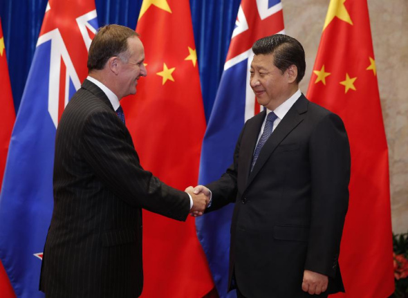 Chinese President Xi Jinping (R) meets with visiting New Zealand's Prime Minister John Key in Beijing, capital of China, March 19, 2014. John Key is paying a working visit to China from March 18 to 20 at the invitation of Chinese Premier Li Keqiang. (Xinhua/Ju Peng)