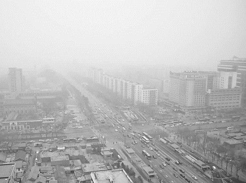 This undated photo shows Beijing is shrouded by smog. (Photo/people.cn)