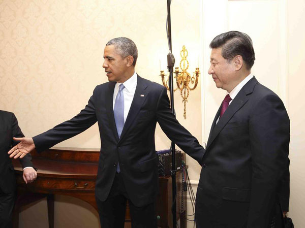 President Xi Jinping meets with his US counterpart Barack Obama in The Hague on Monday. [Photo/Xinhua]