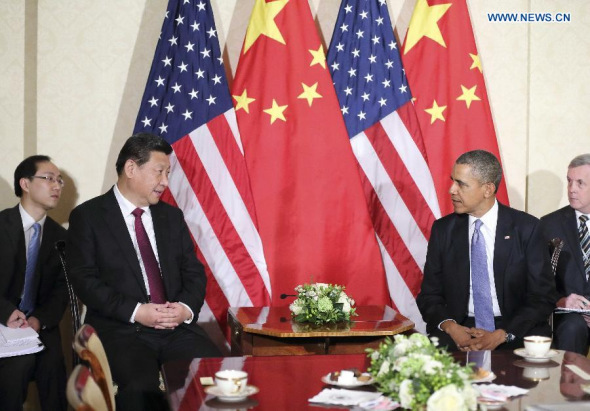 Chinese President Xi Jinping (2nd L) meets with US president Barack Obama (R) in The Hague, Netherlands, March 24, 2014. (Xinhua/Ju Peng)