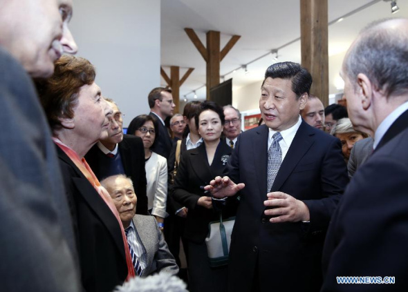 Chinese President Xi Jinping (2nd R, front) visits the former site of the Lyon Sino-French Institute in Lyon, France, March 26, 2014. (Xinhua/Ju Peng)