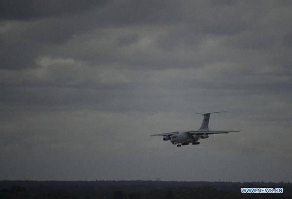 A Chinese IL-76 aircraft returns to Perth International Airport after a search operation, Australia, March 29, 2014. A Chinese Ilyushin IL-76 aircraft spotted on Saturday three suspicious objects in a new search waters in the Indian Ocean, north to the previous area. (Xinhua/Lui Siu Wai)