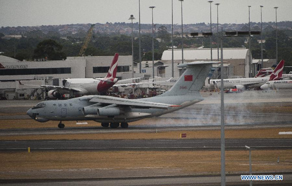 A Chinese IL-76 aircraft returns to Perth International Airport after a search operation, Australia, March 29, 2014. A Chinese Ilyushin IL-76 aircraft spotted on Saturday three suspicious objects in a new search waters in the Indian Ocean, north to the previous area. (Xinhua/Lui Siu Wai)