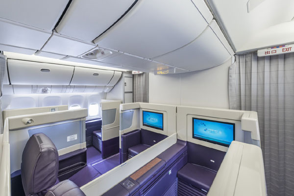 First-class passengers can relax in leather chairs and use a joy stick to maneuver controls on an large-screen entertainment system in front of them. [Provided to chinadaily.com.cn]