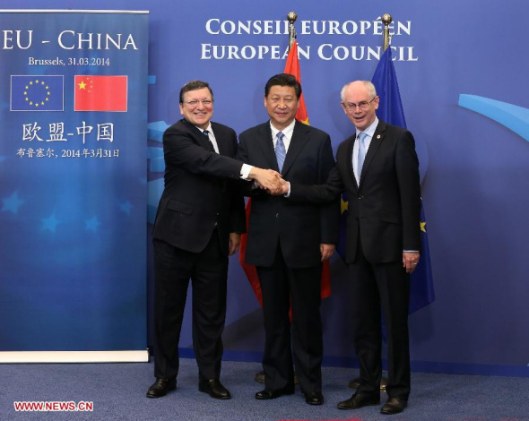 Chinese President Xi Jinping (C) shakes hands with European Council President Herman Van Rompuy (R) and Jose Manuel Barroso, president of the European Commission, during a photocall in Brussels, Belgium, March 31, 2014. Xi attended a work banquet held by Herman Van Rompuy here on Monday. (Xinhua/Pang Xinglei)