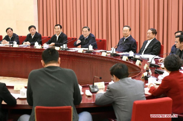 Yu Zhengsheng (back, 4th L), chairman of the National Committee of the Chinese People's Political Consultative Conference (CPPCC), presides over a biweekly symposium of the CPPCC in Beijing, capital of China, April 3, 2014. (Xinhua/Liu Jiansheng)