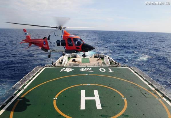Photo taken on March 21, 2014 shows Chinese patrol ship Haixun 01 searching in souther India Ocean. Chinese patrol ship Haixun 01, searching for the missing Malaysian passenger jet MH370, detected a pulse signal with a frequency of 37.5kHz per second in southern Indian Ocean waters Saturday. A black box detector deployed by the Haixun 01 picked up the signal at around 25 degrees south latitude and 101 degrees east longtitude. It is yet to be established whether it is related to the missing jet. (Xinhua/Chen Weiwei)