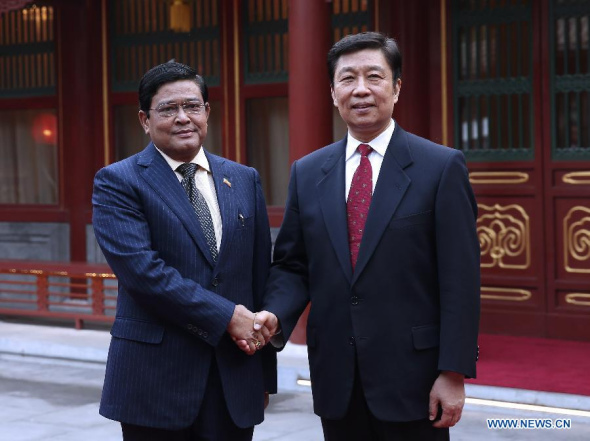 Chinese Vice President Li Yuanchao (R) meets with Myanmar Vice President Nyan Tun in Beijing, capital of China, April 8, 2014. Nyan Tun came to China to attend the opening ceremony of China-ASEAN cultural exchange year in Beijing. (Xinhua/Pang Xinglei) 