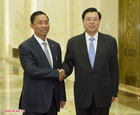 Zhang Dejiang(R), chairman of the Standing Committee of China's National People's Congress (NPC), holds talks with Thura U Shwe Mann, speaker of Myanmar's Union Parliament and the House of Representatives, in Beijing, capital of China, April 10, 2014. (Xinhua/Huang Jingwen)