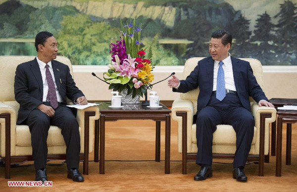 Chinese President Xi Jinping (R) meets with Thura U Shwe Mann, speaker of Myanmar's Union Parliament and the House of Representatives, in Beijing, capital of China, April 11, 2014. (Xinhua/Huang Jingwen)