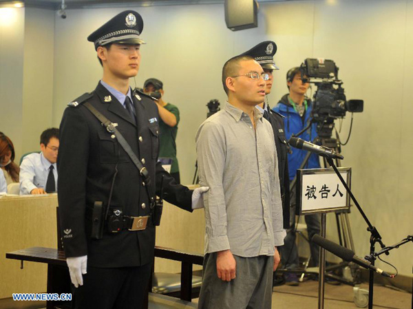 Qin Zhijun, an alleged rumormonger, stood trial at the Chaoyang District People's Court in Beijing, capital of China, April 11, 2014.  [Photo/Xinhua]