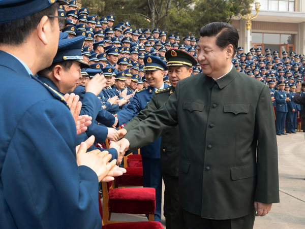 Chinese President Xi Jinping (R front), who is also chairman of the Central Military Commission, meets with air force officers while inspecting the air force's command headquarters on April 14, 2014.[Photo/Xinhua] 
