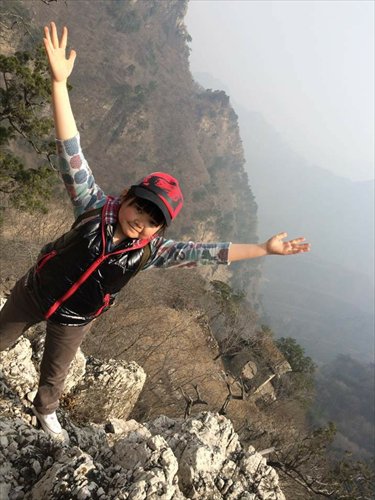 Chen Hongli, 28, from the Little Ants Shadow Play Troupe, takes a photo during an outing of the troupe in a natural resort in Changping, Beijing, in March. Photo: Li Ming