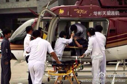 A rescue team is sent to the crash site where one pilot died and another was injured in Miyun County in suburban Beijing on April 10, 2014. [Photo: Beijing Evening News]