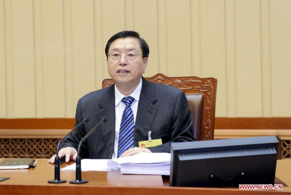 Zhang Dejiang, chairman of the Standing Committee of China's National People's Congress (NPC), presides over the opening meeting of the eighth session of the 12th NPC Standing Committee in Beijing, capital of China, April 21, 2014. (Xinhua/Zhang Duo)