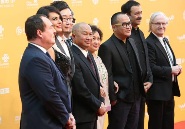 The Tiantan Award jury panel, including Chinese directors Ning Hao (third from right) and John Woo (fifth from right),in the opening ceremony of the 4th Beijing International Film Festival. Jiang Dong / China Daily