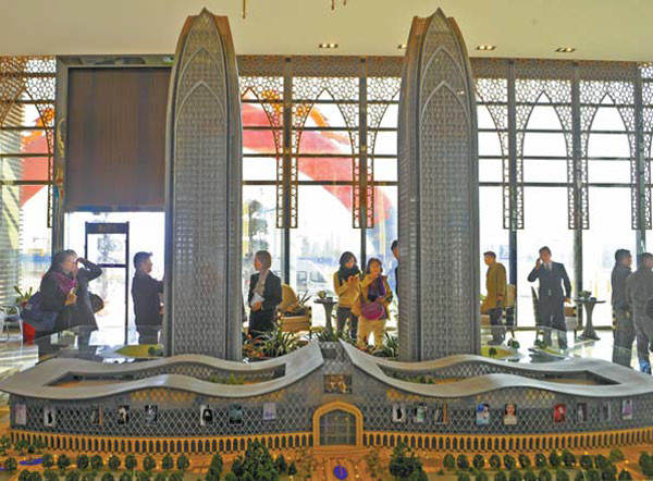 A model of the 280-meter-tall twin towers, part of the Kashgar Development Mansion. Zhao Ge / Xinhua