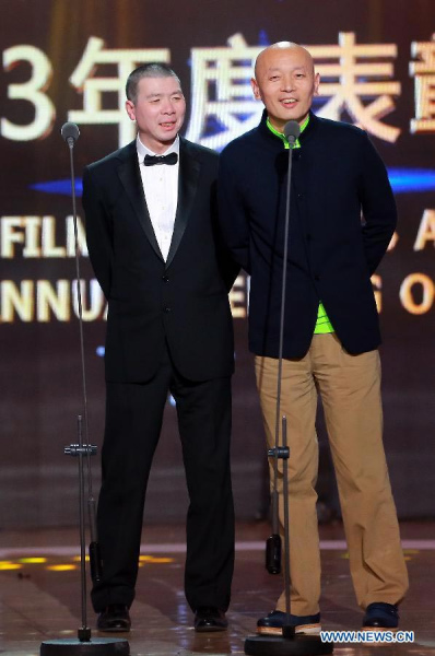 Director Feng Xiaogang and actor Ge You take part in the 2013 annual commendation conference of China Film Directors Guild in Beijing, capital of China, April 9, 2014. [Photo/Xinhua]