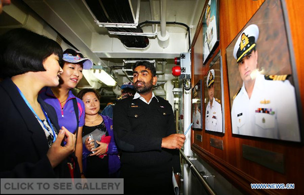 People visit the Pakistan missile frigate at the Dagang Port in Qingdao, east China's Shandong Province, April 22, 2014.