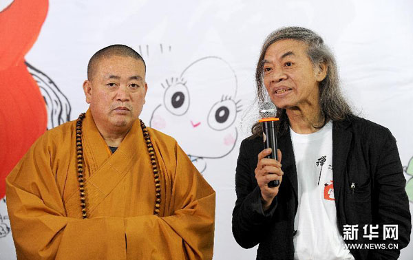 Director of the cartoon Shaolin Temple Tsai Chih Chung (R) and Shaolin abbot Shi Yongxin (L) attend the press conference of the film on May 4, 2014, at the Shaolin Temple in central China's Henan province. [Photo: Xinhua]