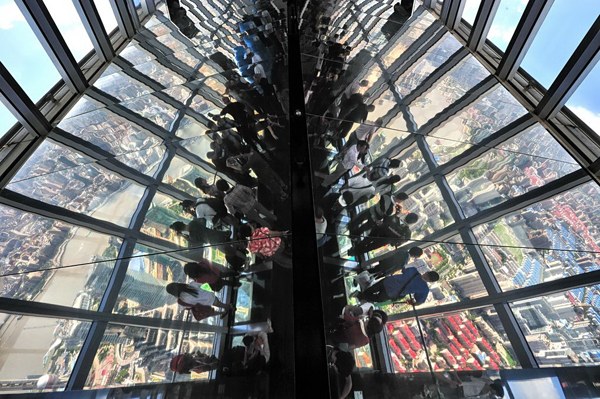People enjoy the view from Shanghai World Financial Center.