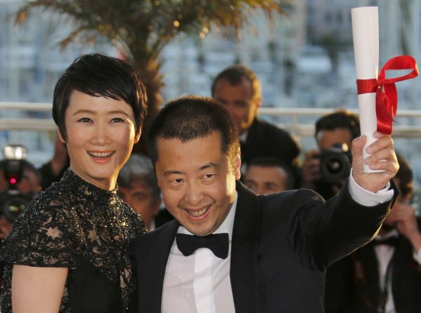 Chinese director Jia Zhangke celebrates after winning at the 66th Cannes Film Festival. Photo provided to China Daily