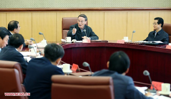 Wang Qishan (back, 2nd R), secretary of the Central Commission for Discipline Inspection (CCDI) of the Communist Party of China (CPC), holds a symposium attended by leaders of some central enterprises in Beijing, capital of China, May 6, 2014.  (Xinhua/Yao Dawei)