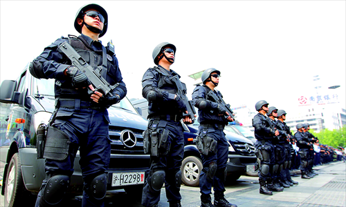 Armed officers from different police departments including SWAT and railway police take part in a ceremony at Shanghai Railway Station Wednesday ahead of the 4th Summit of the Conference on Interaction and Confidence Building Measures in Asia, which will be held in Shanghai next week. Photo: Yang Hui/GT