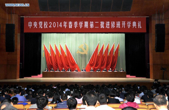 Liu Yunshan (C back), member of the Standing Committee of the Political Bureau of the Communist Party of China (CPC) Central Committee and president of the Party School of the CPC Central Committee, attends an orientation session of the school's 2014 spring semester, in Beijing, capital of China, May 15, 2014. (Xinhua/Rao Aimin)